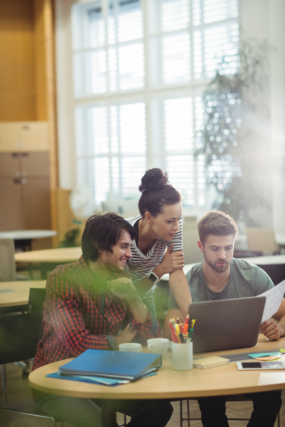 group business executives discussing laptop their des